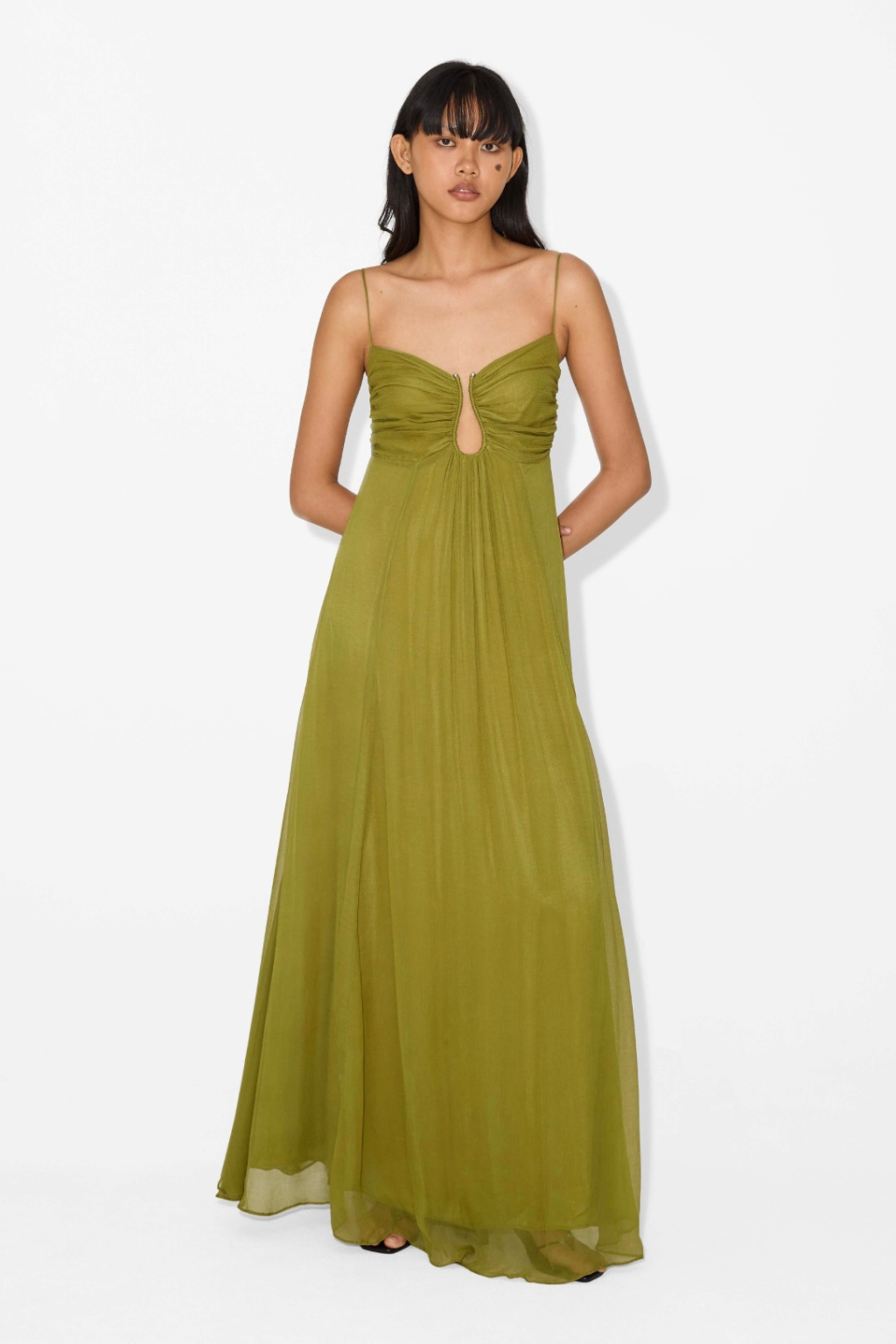 women wearing green maxi dress